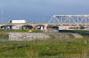 Placing rock - and note the big riprap - under I-5 Bridge spanning Skagit River